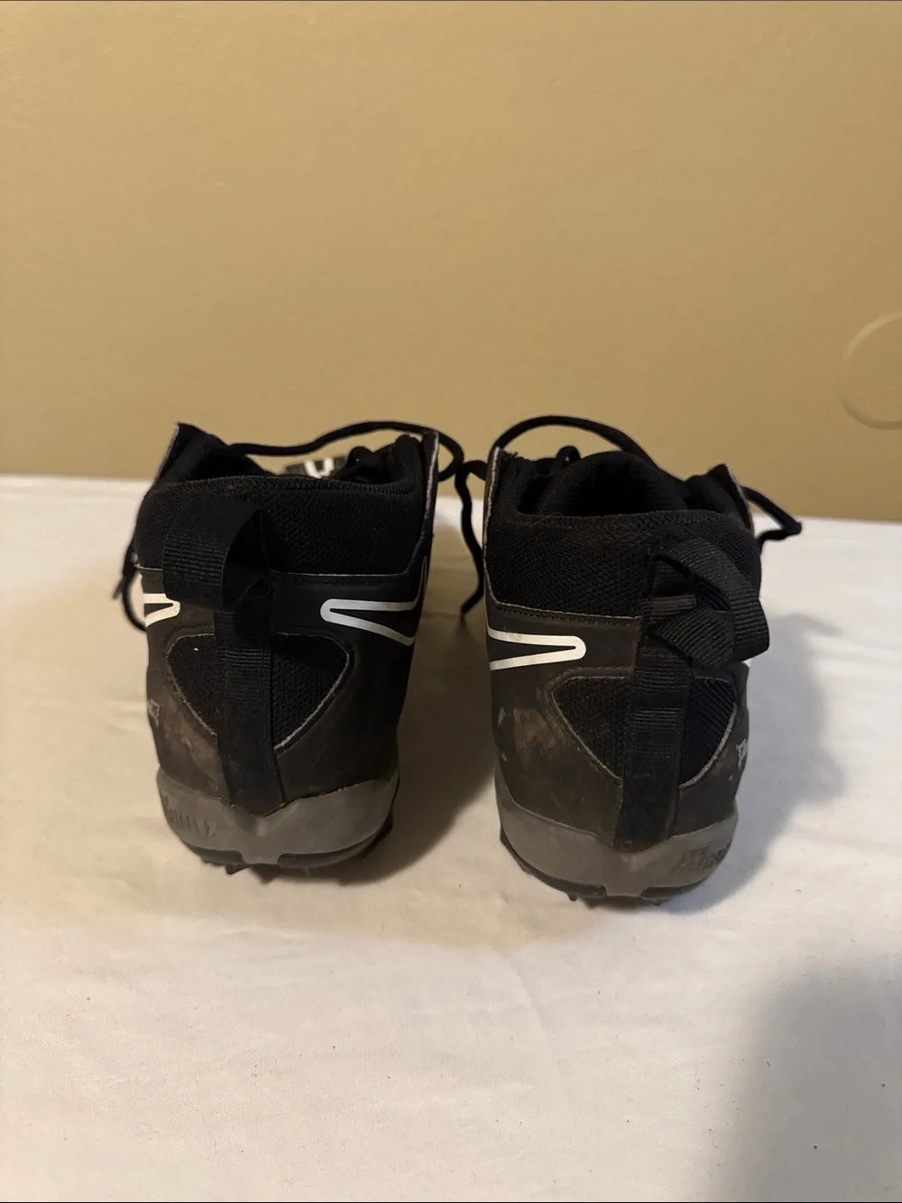 Nike Men’s Black Athletic Cleats with White Swoosh Accents
